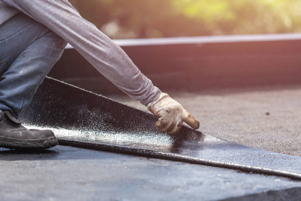 Professional Basement Waterproofing technician working in Holtsville, NY